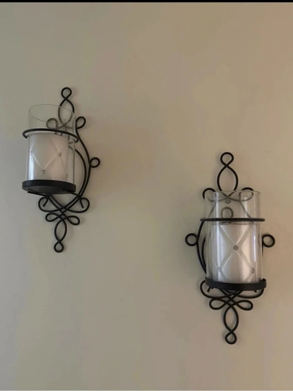 Black Scroll Metal Wall Sconce Pair with Clear Glass Candle Holders
